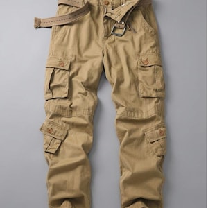 May include: Khaki cargo pants with multiple pockets and a matching belt. The pants have a button and zipper closure, and drawstrings at the ankles. The belt features a silver-colored buckle. The pants are made of a durable fabric.