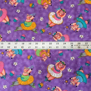 May include: Purple fabric with a repeating pattern of dancing pig ballerinas in tutus, holding wands, and cupcakes. White flower and star accents complete the whimsical design. The fabric is 29 inches wide.