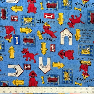 May include: Blue fabric featuring red cartoon dogs, yellow fire hydrants, and bone shapes. The fabric includes the text "Clifford" and "dog" with a repeating alphabet pattern. A fun, playful design.