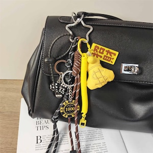 Portachiavi a forma di borsa porta soldi, ciondolo a forma di borsa portafortuna, portachiavi portafortuna, accessorio per fiches da casinò, grazioso ciondolo di peluche a forma di dollaro, ciondolo a forma di borsa porta prosperità