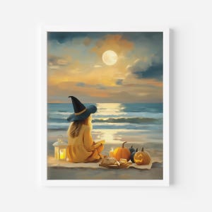May include: A framed painting depicts a person wearing a witch hat, sitting on a beach at sunset. A full moon shines above the ocean. Pumpkins, candles, and a lantern are on a blanket. The person is wearing a yellow dress.
