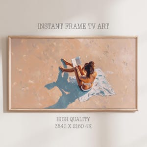 May include: A framed print of a woman reading a book on a beach. The artwork features a woman in a white bikini sitting on a towel, with the text "INSTANT FRAME TV ART" and "HIGH QUALITY 3840 X 2160 4K".