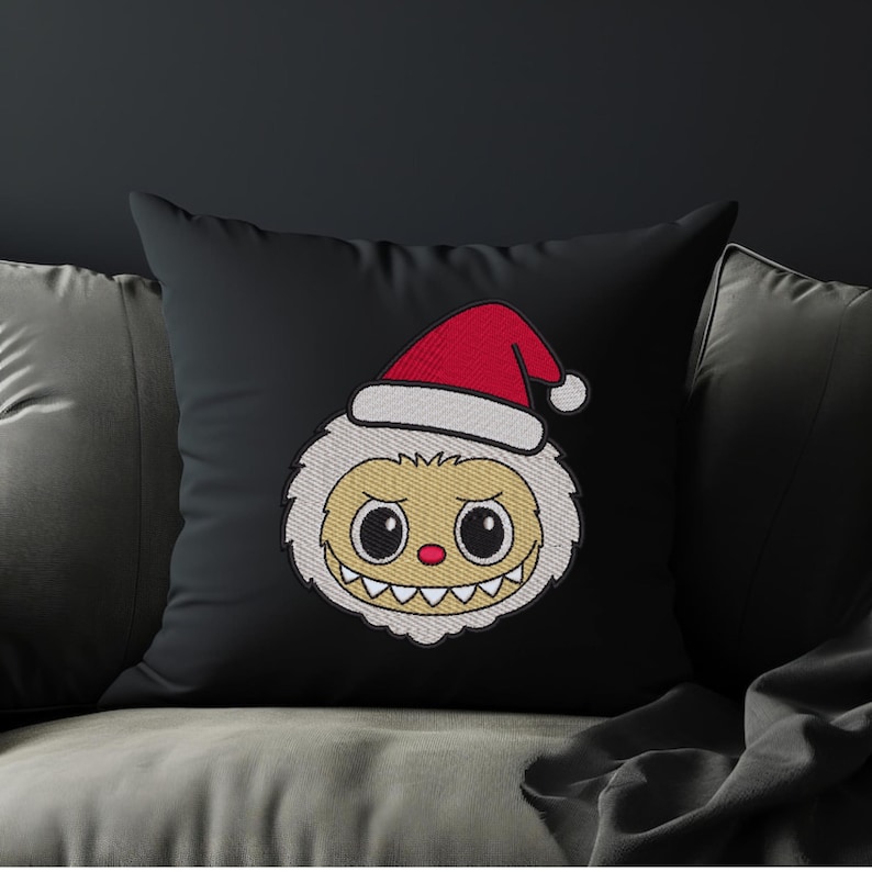 Black throw pillow with cute Santa hat kawaii monster embroidery design – Christmas-themed cartoon embroidery home decor mockup