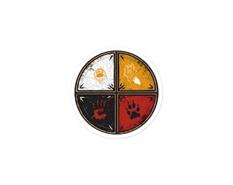 May include: A round sticker featuring a four-section design with a distressed, vintage aesthetic. Each section is a different color: white, yellow, black, and red. The sections contain a bear claw, handprint, paw print, and a sun-like symbol.