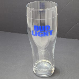 May include: A white ceramic mug with a black handle and the text "But First, Coffee" in a handwritten style. The mug is likely 11-15 ounces, perfect for a morning beverage.