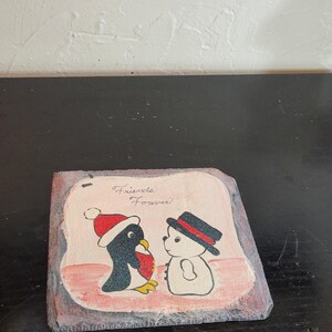 Winter themed penguin and snowman painting on slate tile