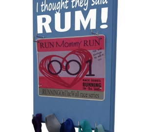 Race bibs and medals holder - medals holder for race bibs and medals, I thought they said RUM!