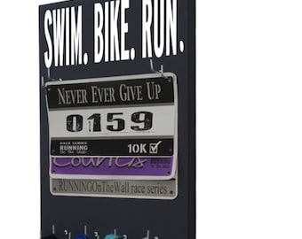 A Race Bib Holder that adds Style to your running Bibs and triathlons bibs - Swim. Bike. Run graphic