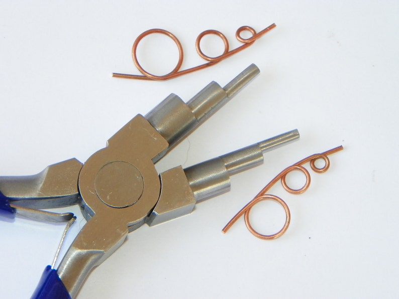 May include: A pair of silver-toned jewelry pliers with blue handles, used for making loops in wire.  Two pieces of copper wire are shown with loops made using the pliers.