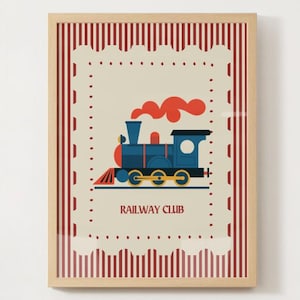 May include: Framed print featuring a blue train with red accents and orange smoke, set against a cream background. The print is bordered by a red and white striped design and includes the text "RAILWAY CLUB".