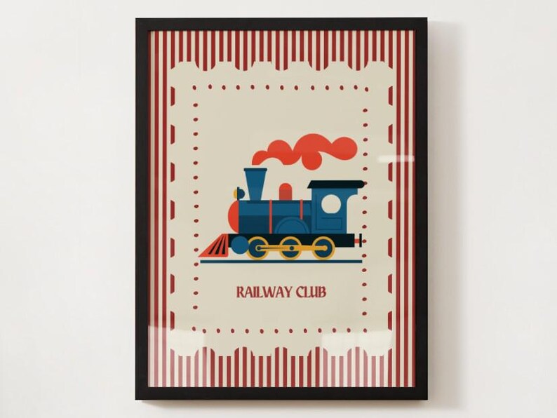 May include: Framed print featuring a blue train with red accents and orange smoke, set against a cream background with a decorative border. The words "RAILWAY CLUB" are printed below the train. The frame is black.