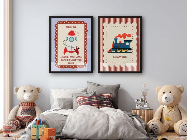May include: Two framed art prints with black borders. One features a rocket with the text "Dream Big...and let your goals rocket beyond your fears." The other shows a blue train with the text "Railway Club."