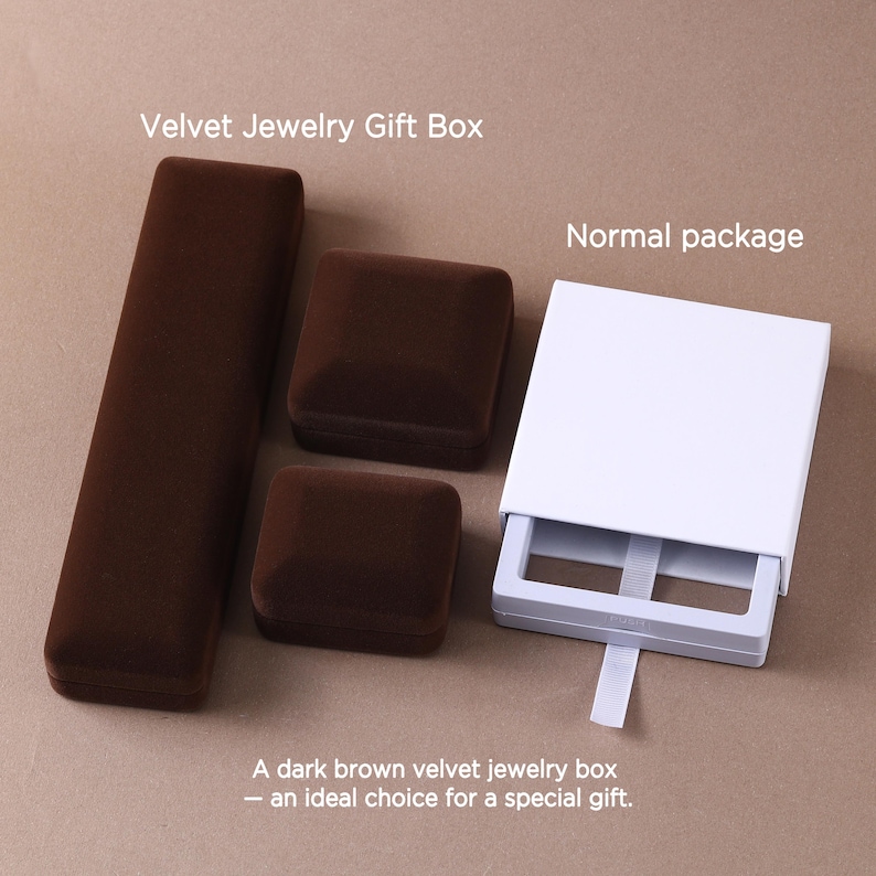 May include: Three dark brown velvet jewelry boxes in rectangular and square shapes, alongside a white cardboard sliding drawer package with a white ribbon pull tab. The text Velvet Jewelry Gift Box and Normal package appear above.