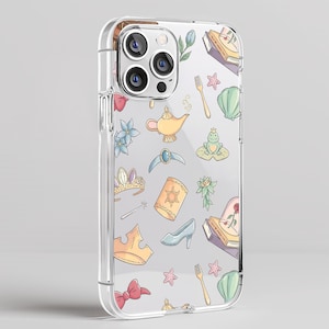 May include: Clear phone case with a whimsical pattern of fairytale-themed illustrations. The design includes a golden lamp, a frog on a lily pad, a glass slipper, a crown, and a rose in a glass dome.