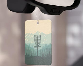 Ambientador para coche con diseño de canasta de disc golf / Silueta de bosque de montaña