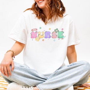 Cheerful Nurse T-Shirt, Gift for Healthcare Workers, Cute Medical Apparel, Inspirational Nurse Tee, Unisex Shirt for Nurses