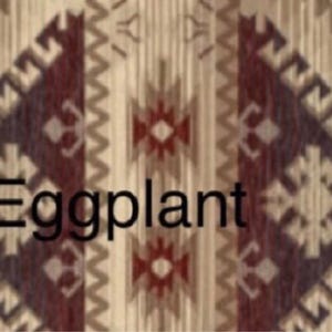 May include: A textile featuring a repeating geometric pattern in shades of beige, cream, and deep eggplant purple. The design includes zigzag lines and diamond shapes arranged in vertical columns. The word Eggplant is printed in black text.