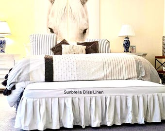Custom bench slipcover with pleated skirt and piping