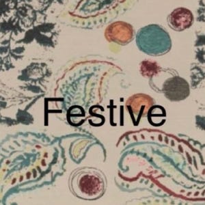 May include: A cream-colored fabric featuring a repeating pattern of dark blue floral motifs, teal and red paisley shapes, and scattered multicolored circles. The word Festive is printed in bold black sans-serif letters across the center.