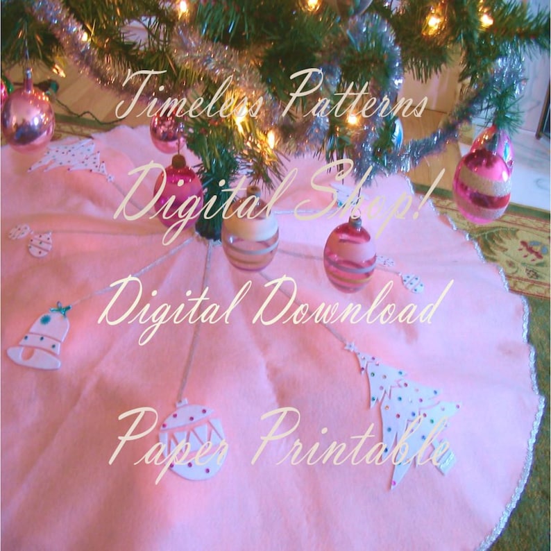 May include: Pink Christmas tree skirt with white bells, ornaments, and a tree topper. The skirt has a scalloped edge and is decorated with the text "Timeless Patterns Digital Shop! Digital Download Paper Printable".