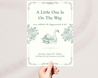May include: A cream-colored invitation with green text and illustrations. The text reads "A Little One Is On The Way" with a swan illustration. The invitation also includes event details: Saturday, August 30th, 2:00pm, and an address.