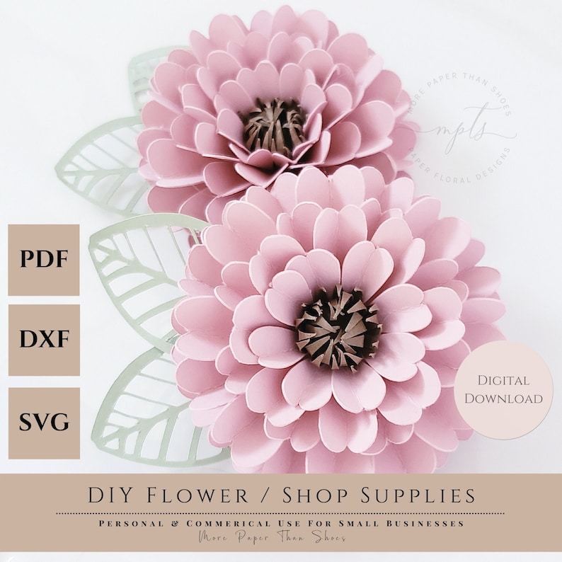 May include: Digital download of a DIY paper flower design. The design features two pink flowers with brown centers and green leaves. The text "More Paper Than Shoes" is also included.