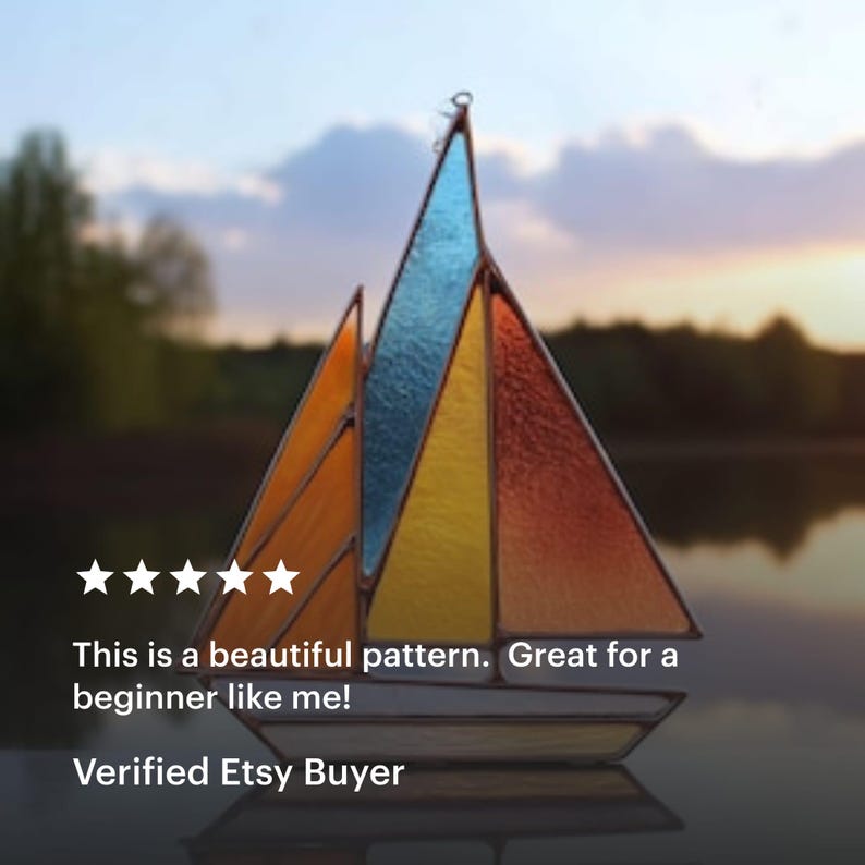 May include: A stained glass sailboat with a colorful design. The sails are composed of orange, yellow, and blue glass panels. The text on the image reads: "This is a beautiful pattern. Great for a beginner like me!" and "Verified Etsy Buyer."