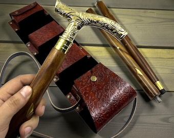 Bastón plegable de madera de estilo vintage con mango de latón y estuche de cuero.