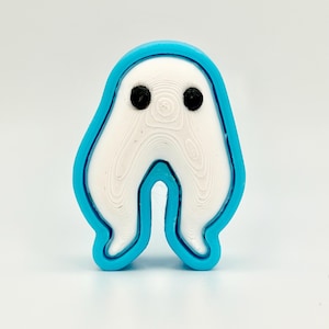 Figuras y clickers de críptidos de patas largas y polillas: figuras antiestrés impresas en 3D.