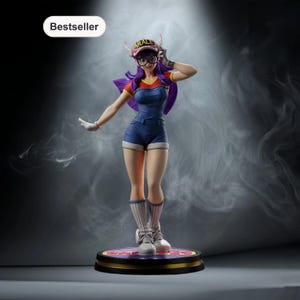 May include: A figurine of a character wearing a denim jumpsuit, shorts, and a cap with the word "ARALE" on it. The figure has purple hair and is standing on a circular base. The word "Bestseller" is in a white oval in the upper left corner.