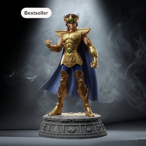 May include: A gold-colored figurine of a warrior in ornate armor, with a blue cape and a green gem on the chest. The figurine stands on a stone base with carved details. The word "Bestseller" is in a white oval in the top left corner.