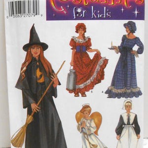 May include: Simplicity pattern 5372 for kids' costumes. The pattern includes five costumes: a witch, a pioneer girl, a pilgrim girl, an angel, and a colonial girl. The pattern is for sizes 2-4, 6-8, 10-12.