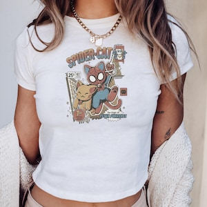 A person wearing a white t-shirt with a Spider-Cat graphic and a necklace.