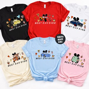 a collection of six t-shirts, each featuring a different Disney character and the text "Best Day Ever" printed on them.