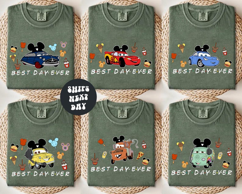 six green t-shirts with various cartoon car designs and the text "BEST DAY EVER" printed on them.