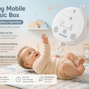 May include: A white, circular battery-operated baby mobile music box by KLEEDUO. The device features a central hook, two speaker grilles, and a battery compartment requiring 2 x AAA batteries. Text on the unit includes DC 3V, AAAx2, and OPEN CLOSE.