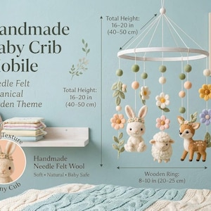 May include: A handmade baby crib mobile featuring needle felt wool figures of a bunny, a sheep, and a deer, accented with felt flowers and leaves hanging from a wooden ring. The total height is 16-20 inches and the ring is 8-10 inches wide.