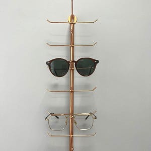 Organizador de gafas metálico de pared de 7 compartimentos / Estante expositor de gafas para el hogar y ópticas