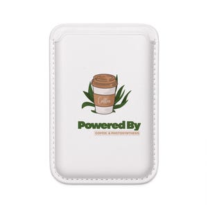 May include: White phone case with a coffee cup graphic, green leaves, and the text "Powered By Coffee & Photosynthesis". The coffee cup is brown and white with the word "Coffee" written on the side.
