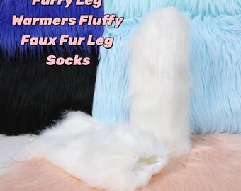 May include: White faux fur leg warmers and socks. The image shows a pair of white leg warmers and socks, with a fluffy texture. The background features blue, black, and pink faux fur.