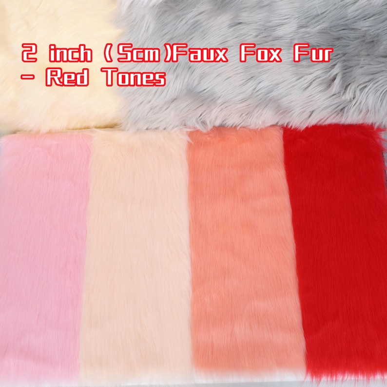 May include: Faux fox fur in red tones, 2 inches thick. The image displays various shades of red, pink, and cream-colored faux fur. The text in the image reads "2 inch (5cm) Faux Fox Fur - Red Tones."