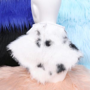 Cozy cow print neck fur crafted with synthetic faux fur material featuring fluffy texture and charming spotted design. Great for fursuit makers or performers who seek comfort and visual appeal. The lined inside layer prevents discomfort, making it suitable for extended use during festivals or costume gatherings.