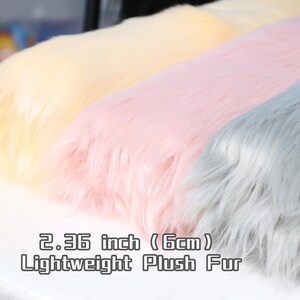 Lightweight faux fox fur fabric with a thick 2.36 inch pile and ultra-soft texture. Made from high-quality synthetic fiber, this plush fabric is perfect for fursuit paws, ears, tails, or fantasy cosplay elements. The large cut of 45 × 85 cm provides enough surface area for creative sewing and crafting. The dense, fluffy feel adds realism and comfort to costume projects.