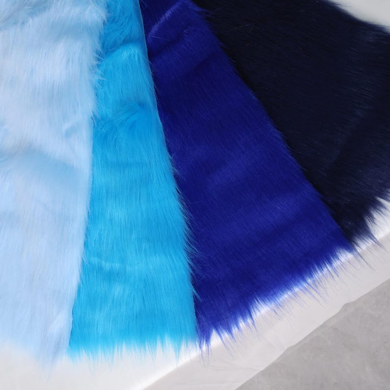 Blue-toned faux fur made from synthetic fibers with a thick 5 cm pile. Great for fursuit hair, tails, costume wig details, or plushies. The 20 by 50 cm size is convenient for small projects and accent pieces. Whether you’re a beginner or advanced sewer, this fabric offers softness, realism, and drama in your furry-themed crafts or cosplay builds.