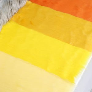 Synthetic yellow faux fur with 2 inch pile height and realistic movement. Designed for plush crafting, costume accents, and fursuit design. The golden hue brings life to characters and makes your builds stand out. Soft and flexible, the fabric is beginner-friendly and great for small projects needing bold color.