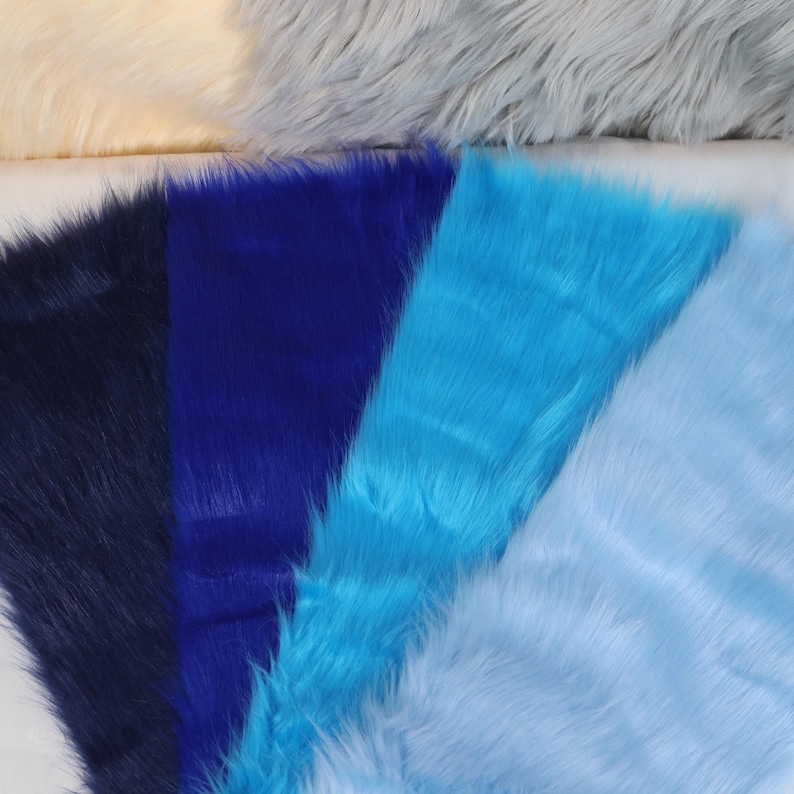 Blue faux fox fur with 2 inch pile designed for costume builders and plush toy makers. This synthetic fabric is perfect for fursuit detailing like ears, tails, or paws. Soft, dense, and vibrant, it’s ideal for colorful characters or fantasy-themed designs. The fabric size is compact yet versatile, and it sews easily by hand or machine, offering beautiful flow and structure.