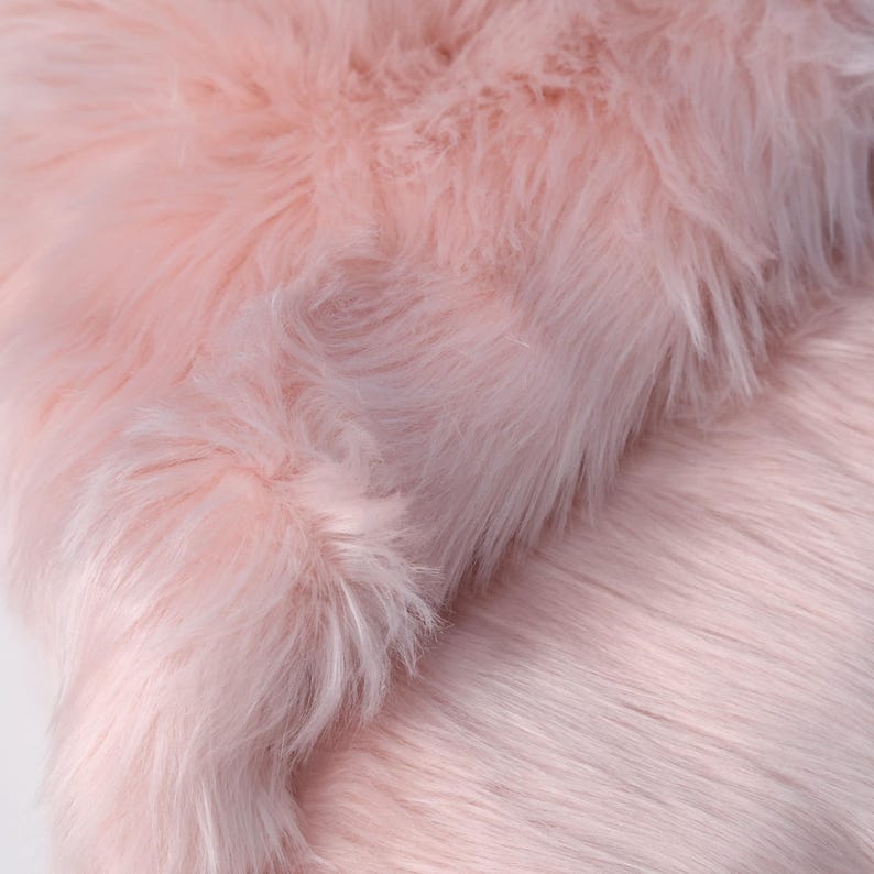 High-density faux fox fur fabric with 2.36 inch pile and soft fluffy finish. Designed for fursuit paws, tails, ears, and plush crafting. The 45 × 85 cm size offers enough fabric for multiple small parts or detailed character builds. Made from cruelty-free synthetic fibers, it provides premium fur texture and durability in a lightweight format.