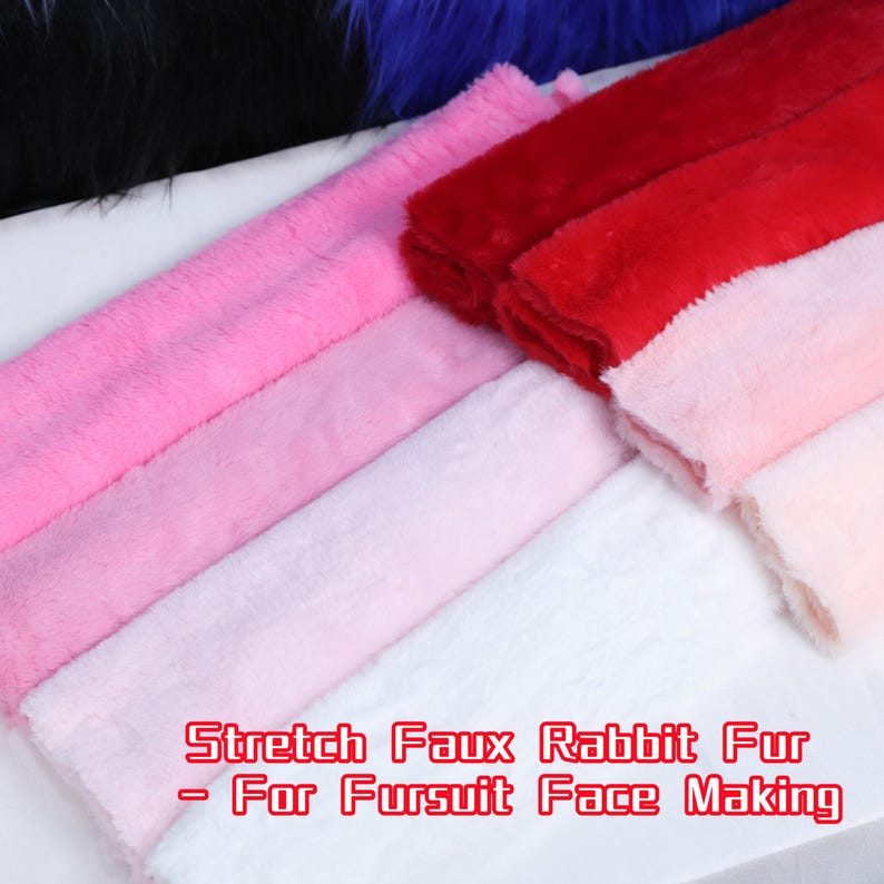 May include: A selection of colorful faux rabbit fur fabric in shades of pink and red. The image includes the text "Stretch Faux Rabbit Fur - For Fursuit Face Making". The fabric is soft and fluffy, ideal for crafting.
