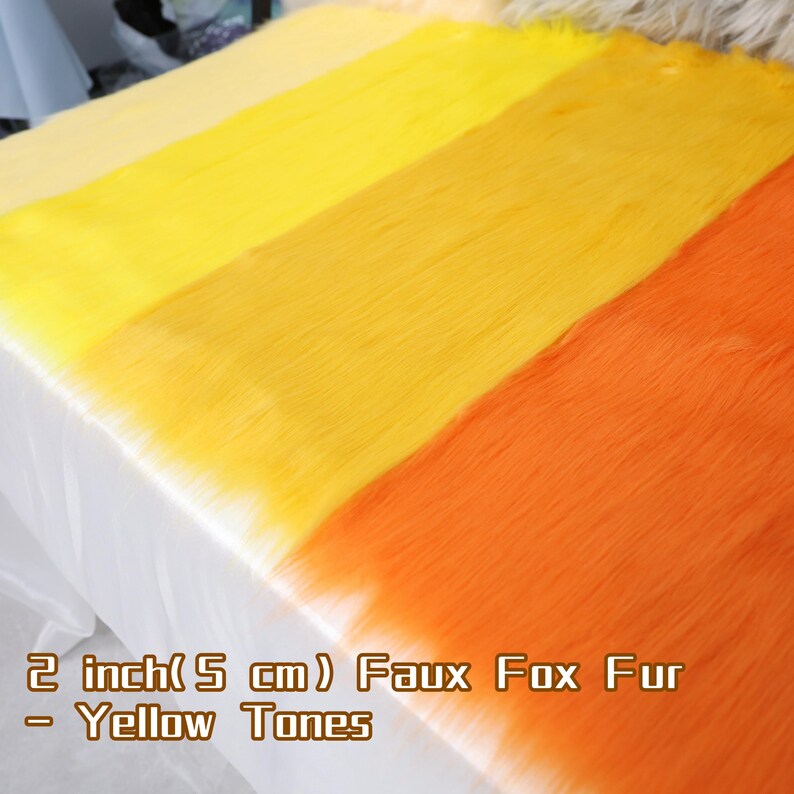 Bright yellow faux fox fur fabric with long 5 cm pile, perfect for fursuit creators, plush artists, and cosplay designers. This soft synthetic fur is easy to cut, sew, and shape, making it ideal for character ears, tails, or prop details. Add warmth, texture, and vibrant flair to your fantasy sewing projects or DIY costumes.