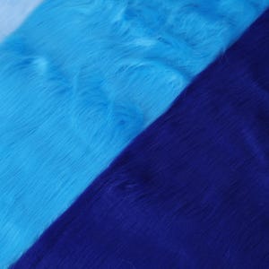 Premium synthetic faux fox fur in blue tones with a 2 inch pile. Ideal for small-scale cosplay pieces, fursuit trims, fantasy animal wigs, or plush toy designs. The texture is soft and flexible, yet dense enough to hold shape when sewn. Great for cosplay enthusiasts and crafters needing a pop of bold color and texture in their work. Perfect for both professionals and hobbyists.